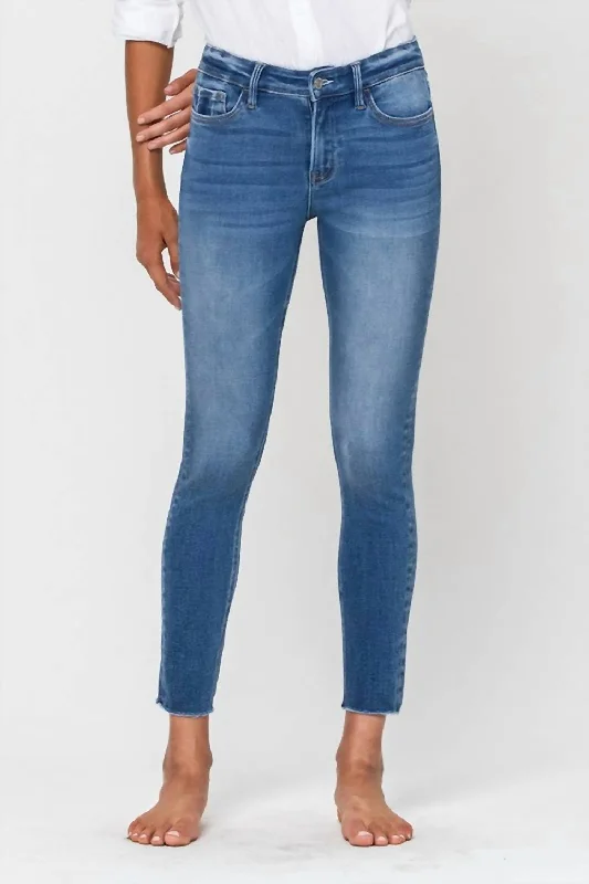 Simon Mid Rise Raw Hem Skinny Jean In Medium Wash